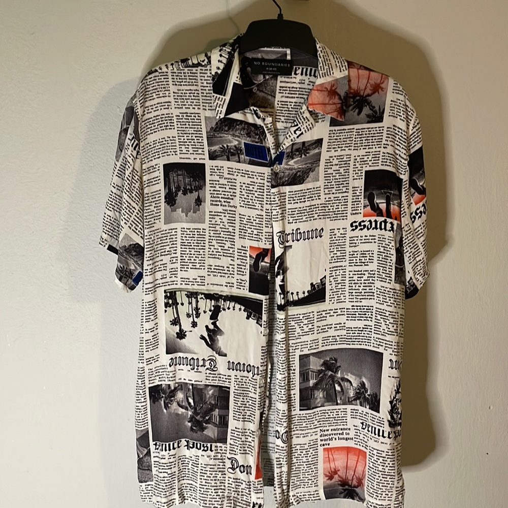 This is a mens medium No Boundaries button up, with a newspaper theme.
